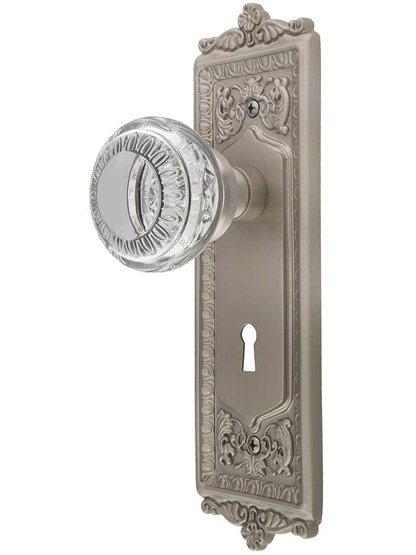 Egg and Dart Style Door Set with Ovolo Crystal-Glass Knobs and Keyhole in Satin Nickel.
